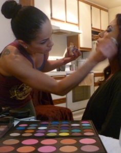 Rios, also a certified makeup artist, helps another competitor get ready for show day. Photo by Megan Looney.