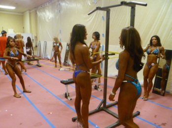 National Physique Committee competitors “pumping up” before getting on stage. Photo by Megan Looney.